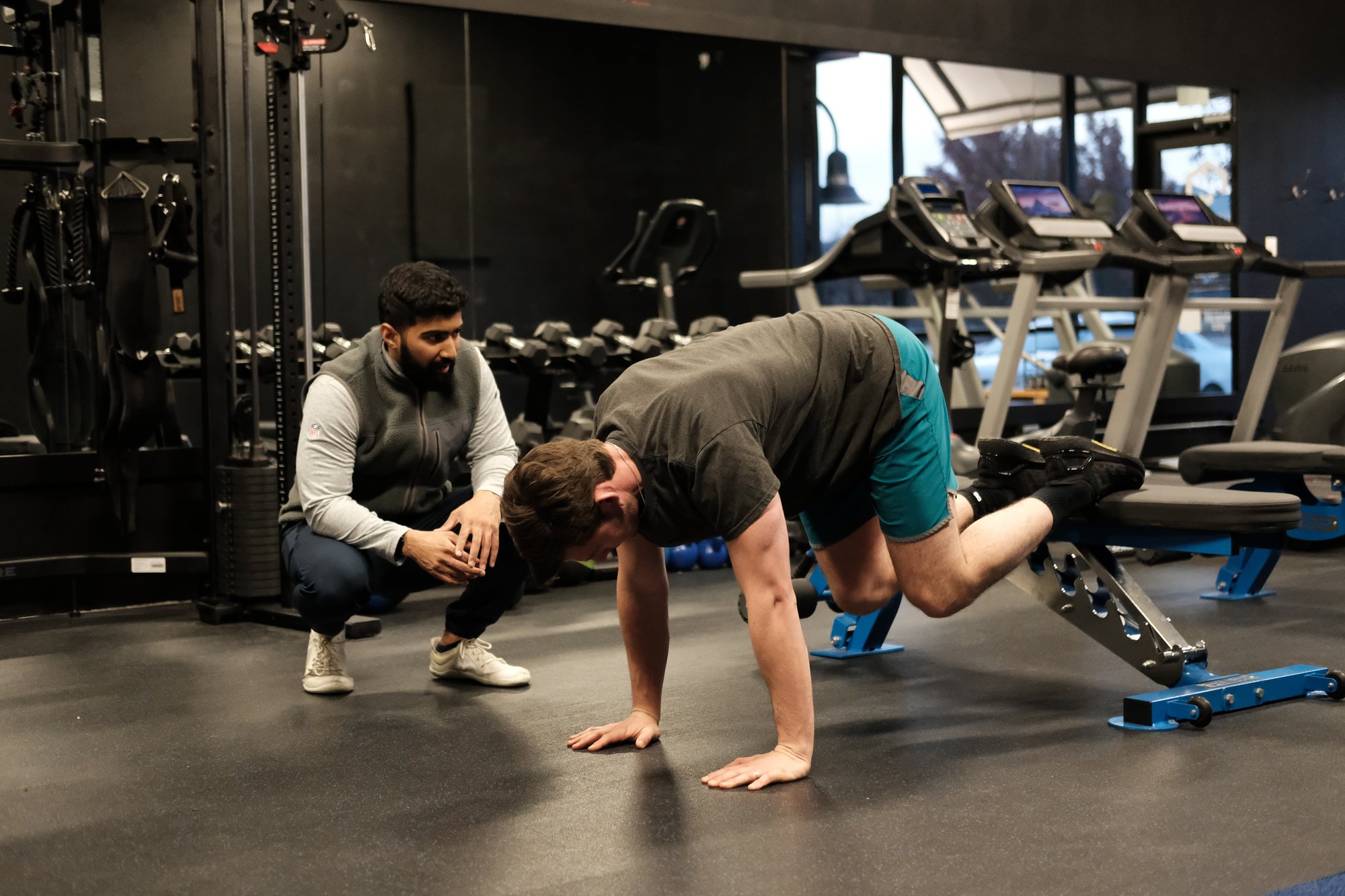 Physical therapist coaching patient