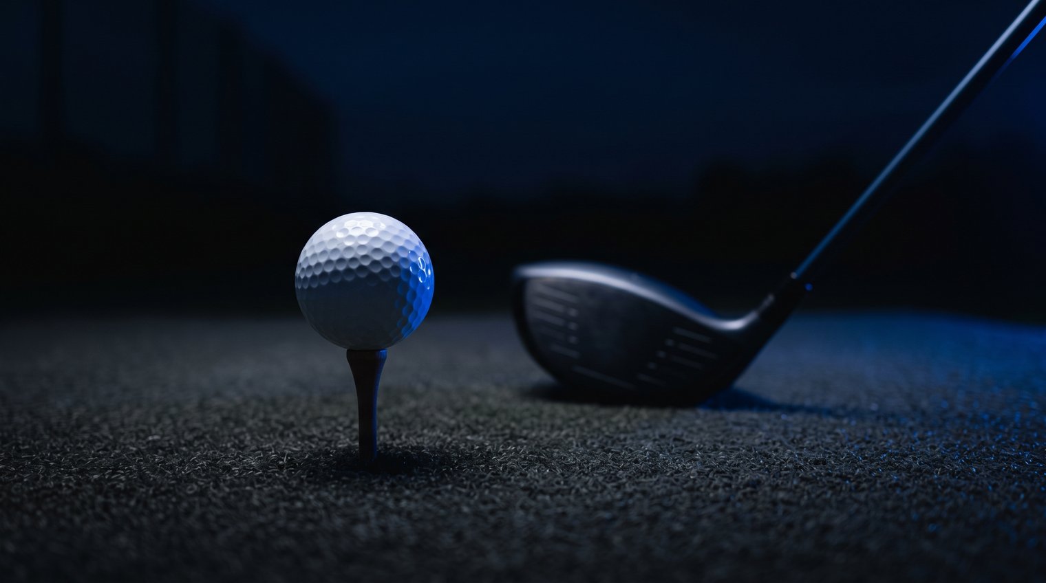 Golf ball on a tee with a driver behind it, golf physical therapy in Farmers Branch